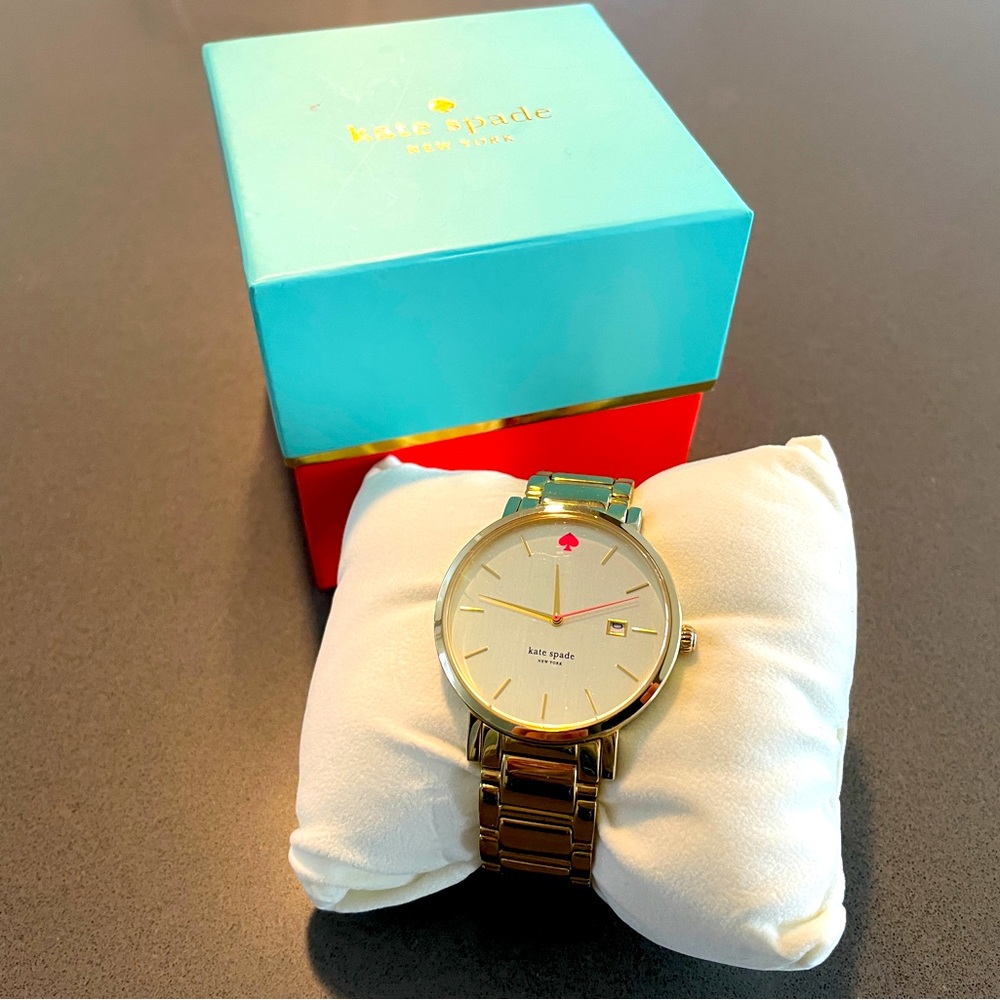 Kate Spade gold watch. Includes original box and all extra links.